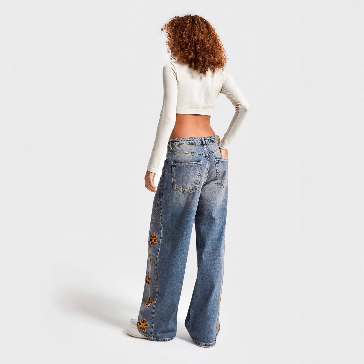 Pantalon large brodé à motifs floraux